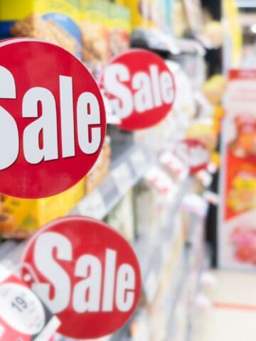 grocery store sale signs in aisle