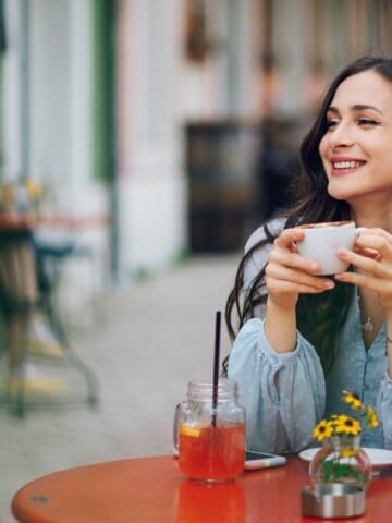 woman eating alone and getting coffee