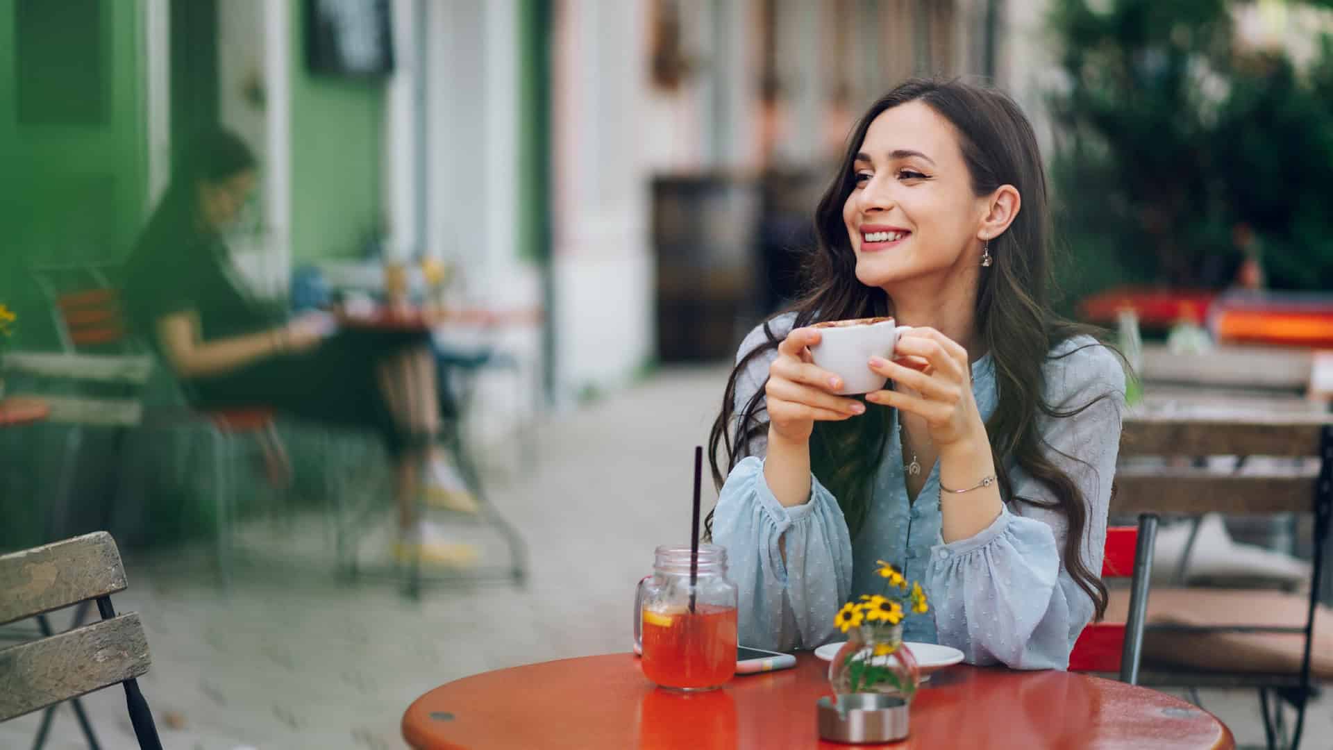woman eating alone and getting coffee