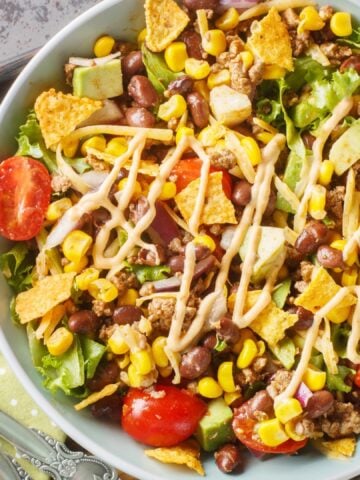 Taco bowl made with tomatoes corn and avocado
