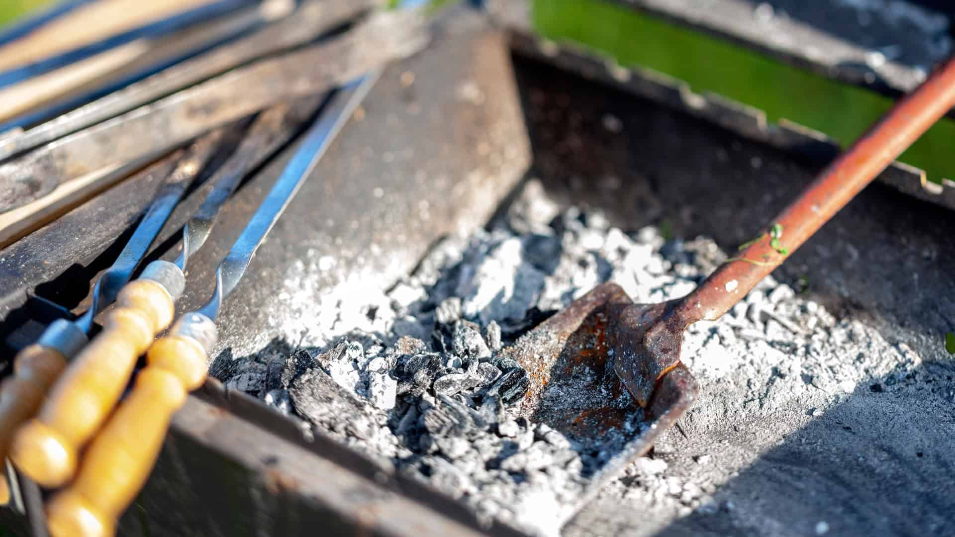 Cleaning the ash out of a grill