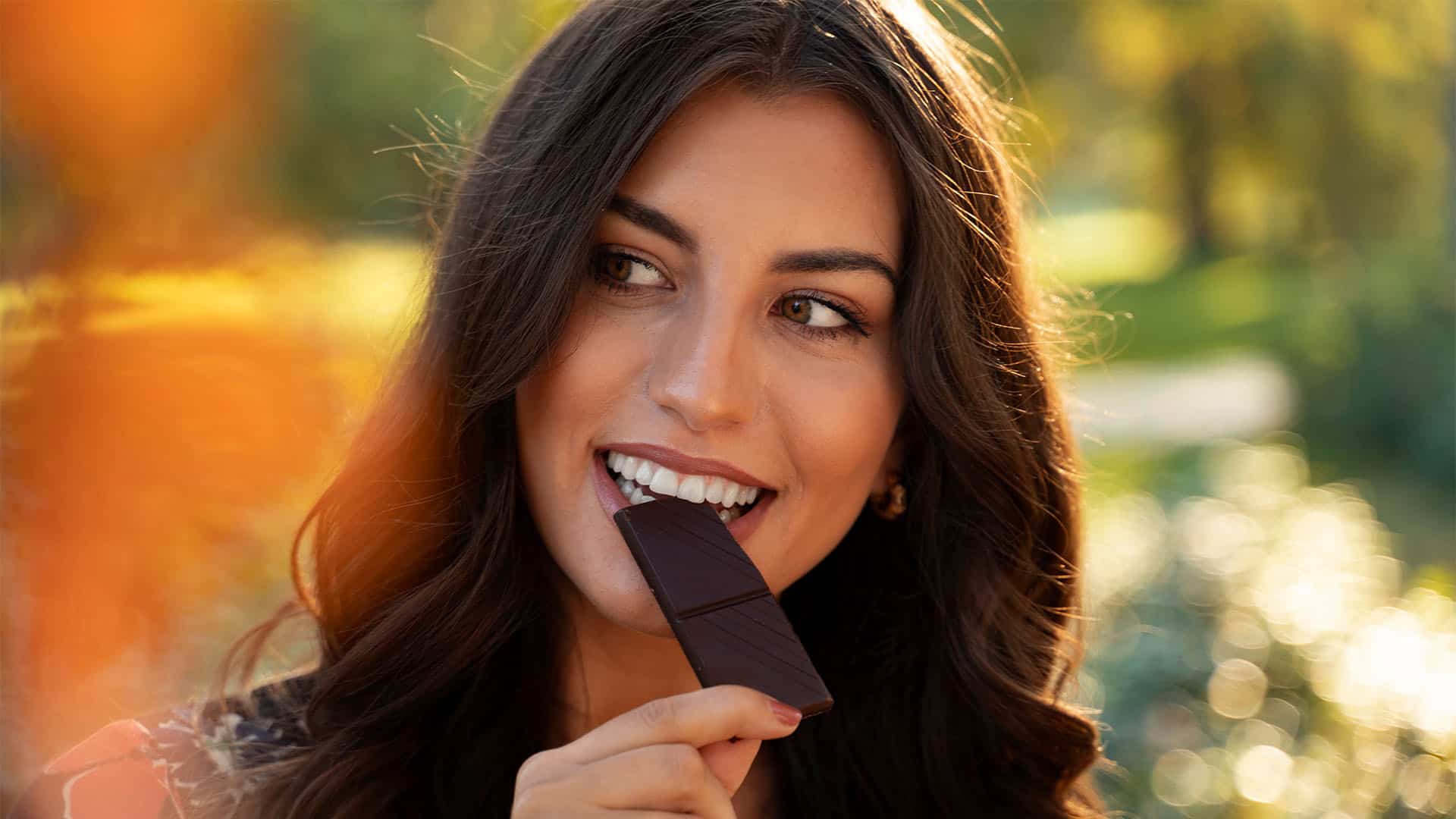 Woman eating chocolate