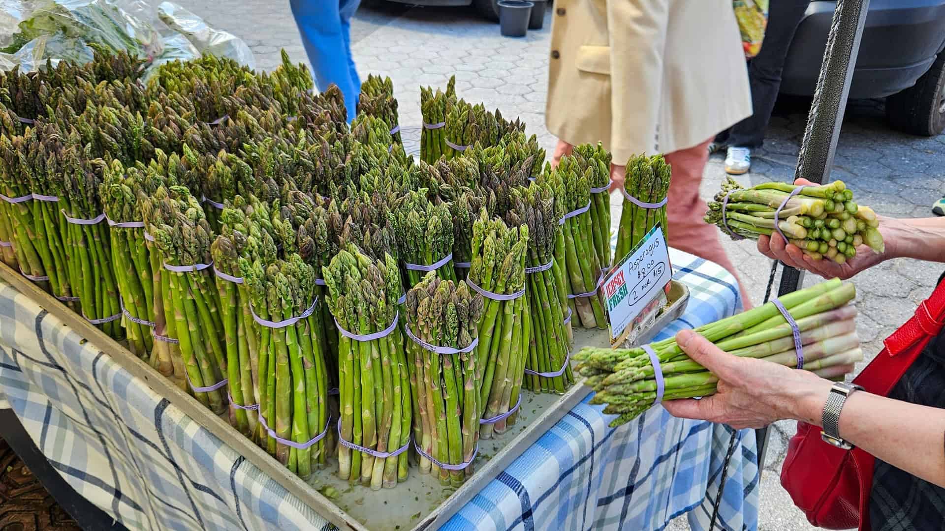 asparagus being sold in an outdoor market