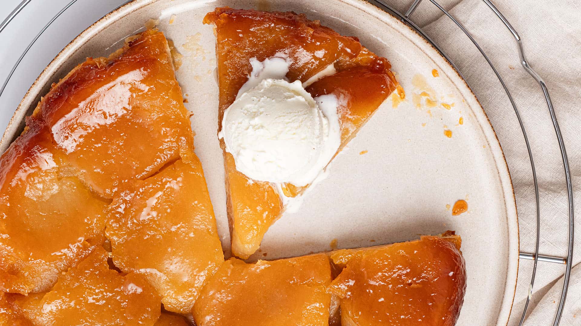 Apple Tarte Tatin on a plate with ice cream.