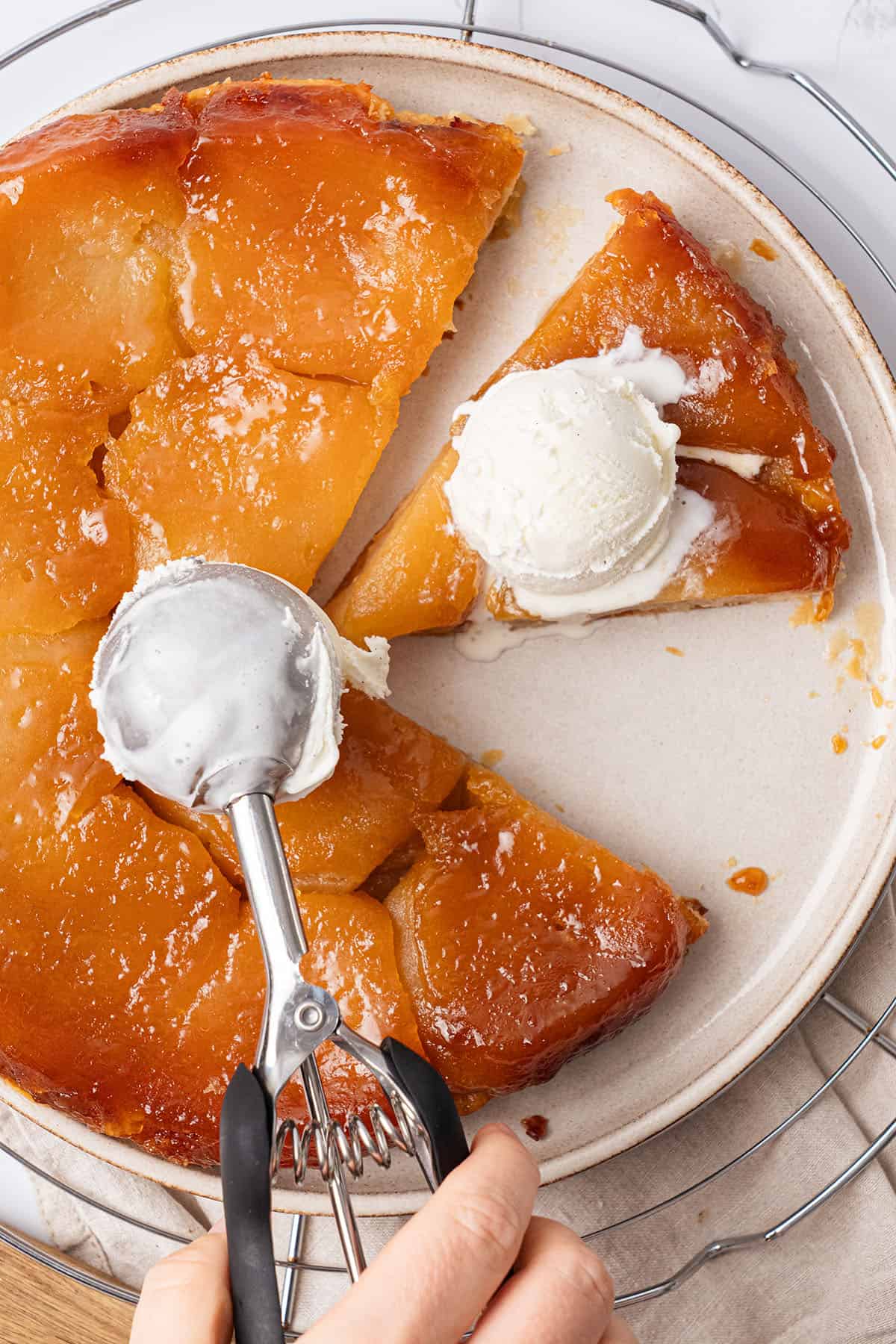 Apple Tarte Tatin on a plate with ice cream.