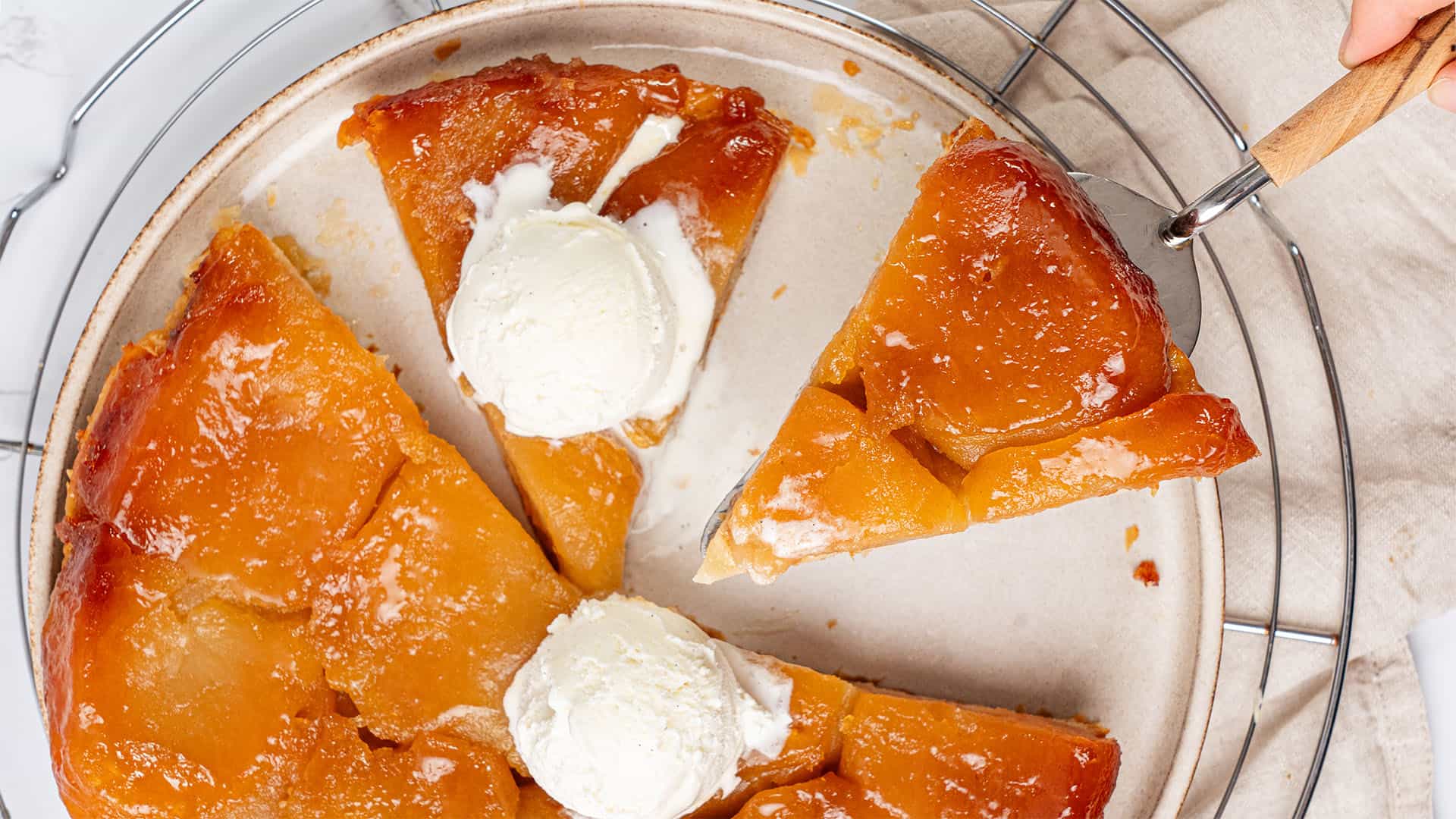 Apple Tarte Tatin on a plate with ice cream.