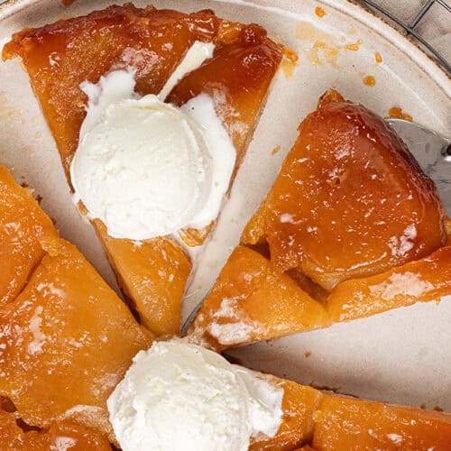 Apple Tarte Tatin on a plate with ice cream.