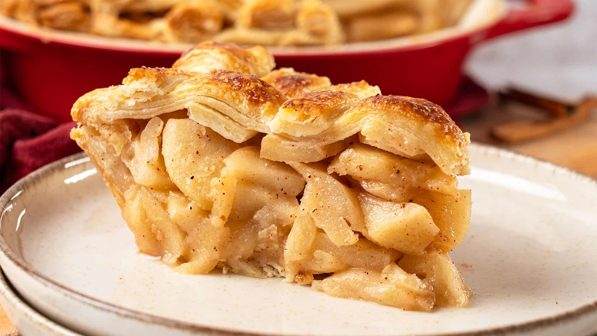 a slice of apple pie on a plate.