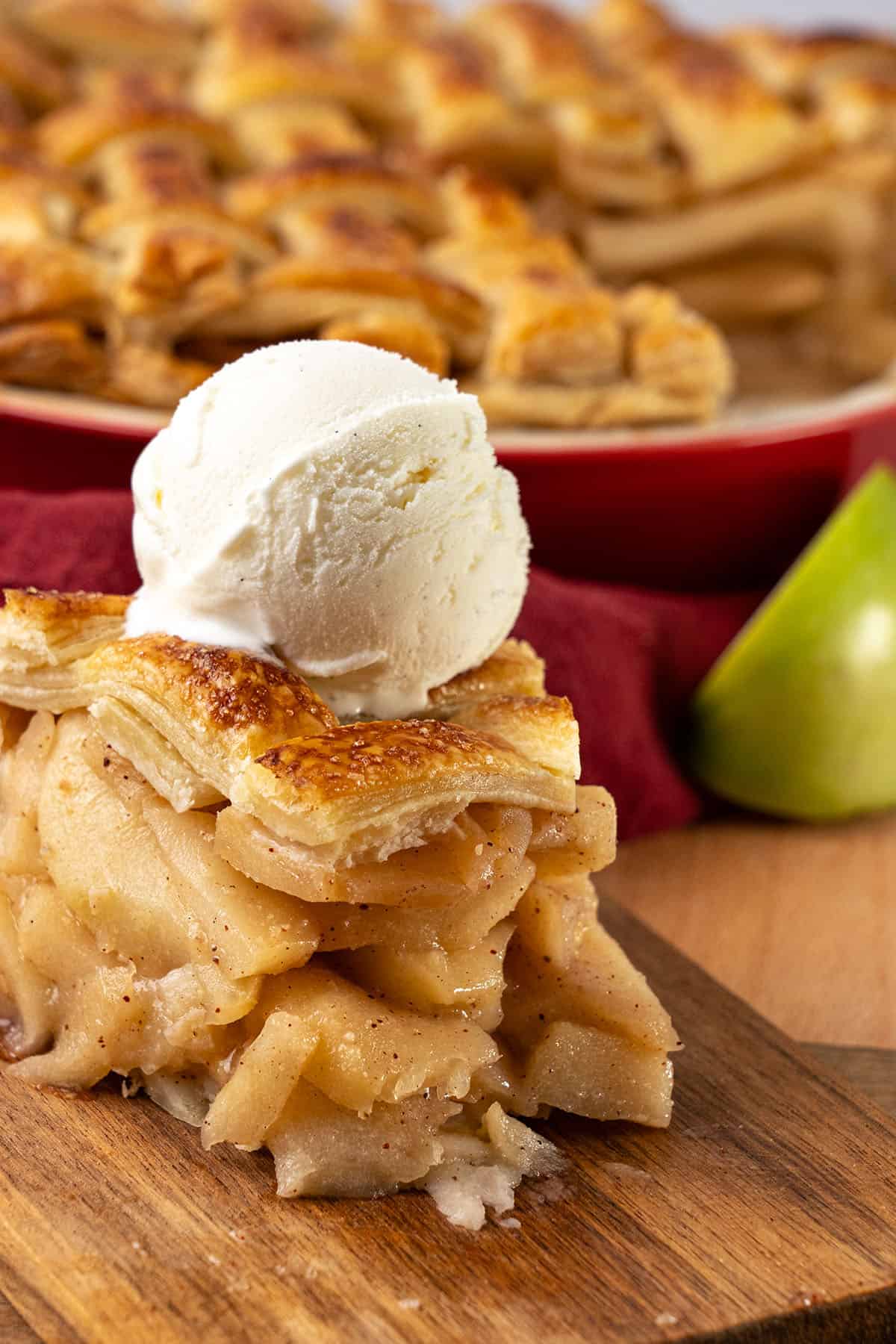 a slice of apple pie with ice cream.