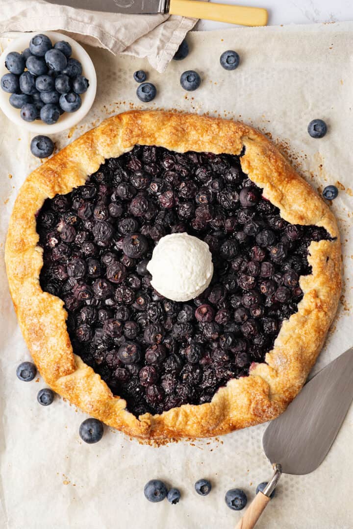 Blueberry galette with a scoop of ice cream.