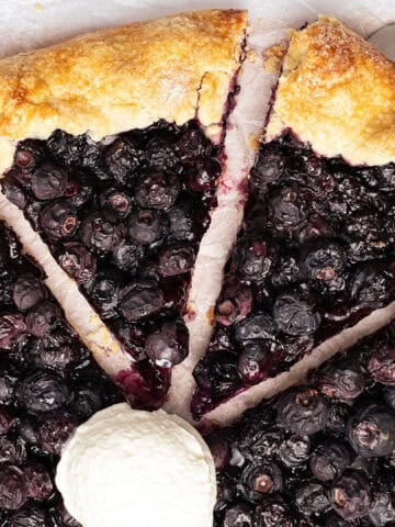 Blueberry galette with a scoop of ice cream.
