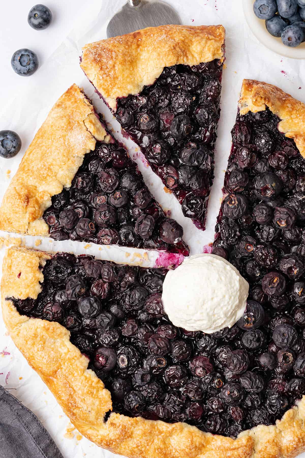 Blueberry galette with a scoop of ice cream.