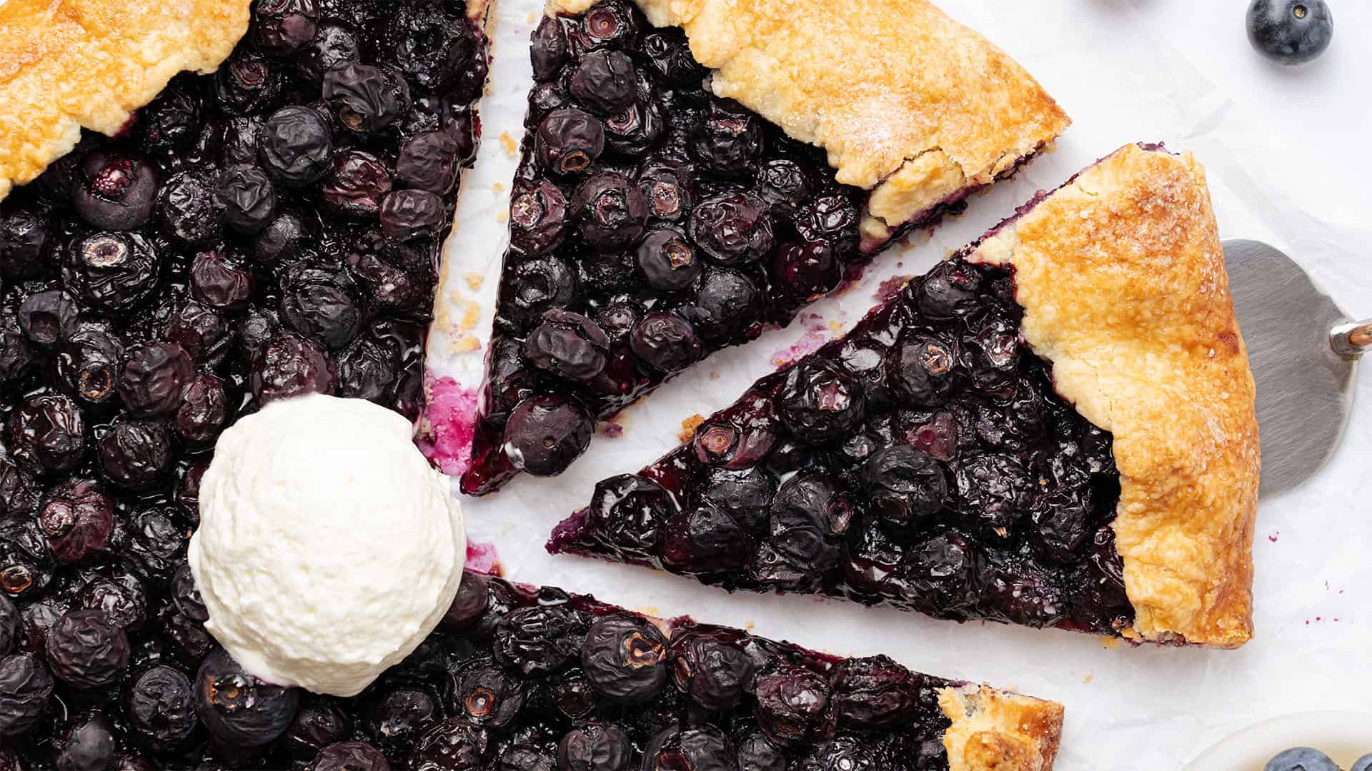 Blueberry galette with a scoop of ice cream.