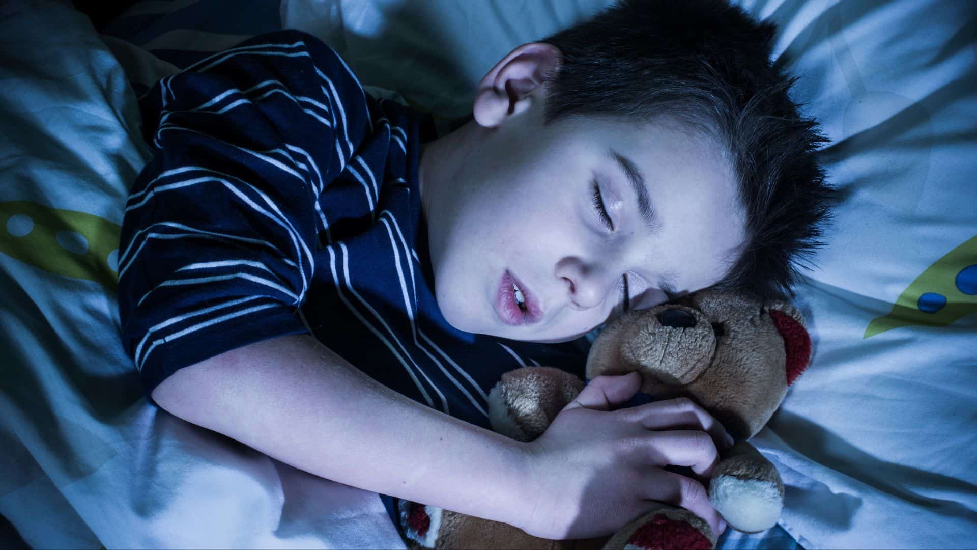 Little boy Sleeping in Bed