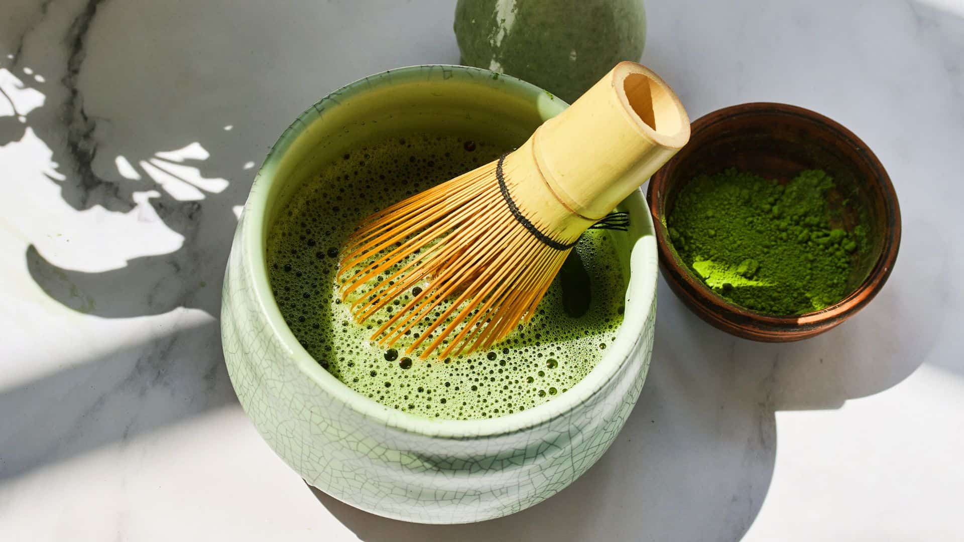 Matcha Tea Preparation. Ceremonial matcha bowl with whisk and matcha powder