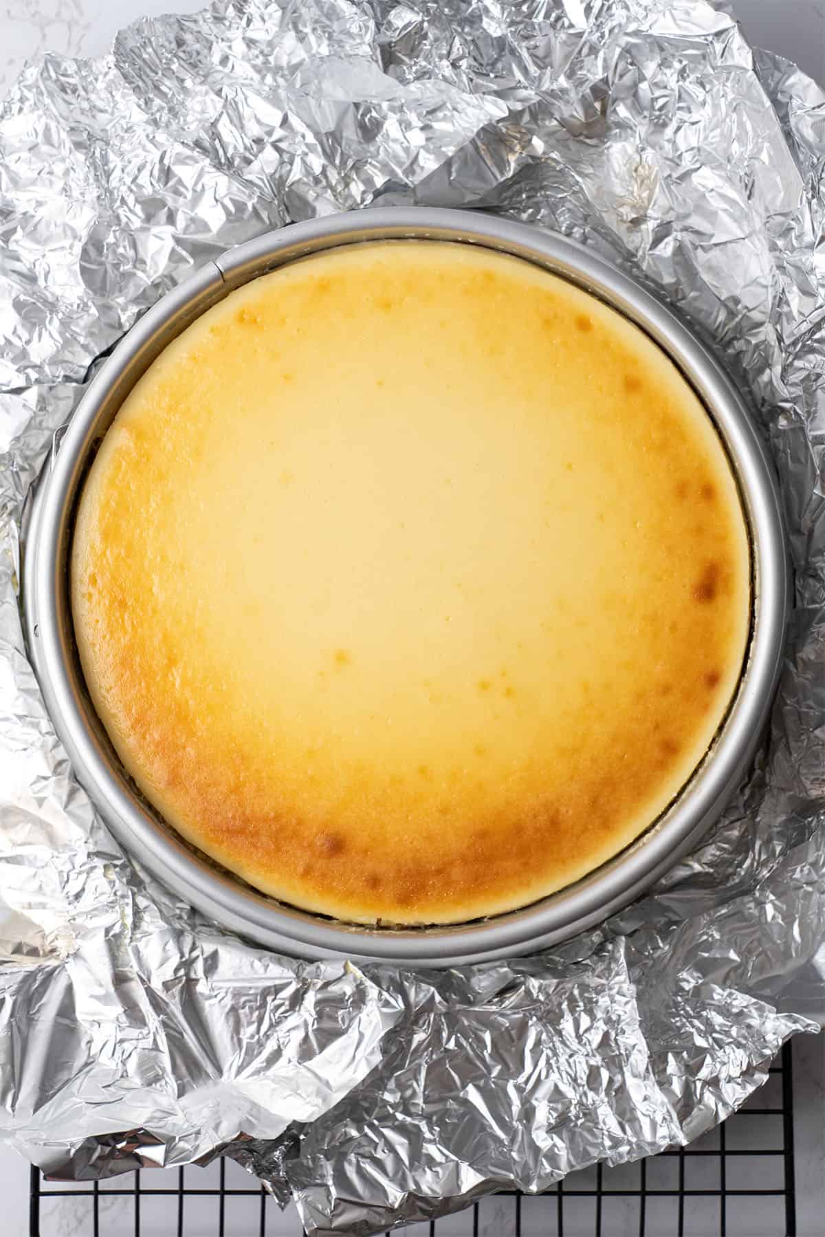 New York cheesecake after baking in a baking form.