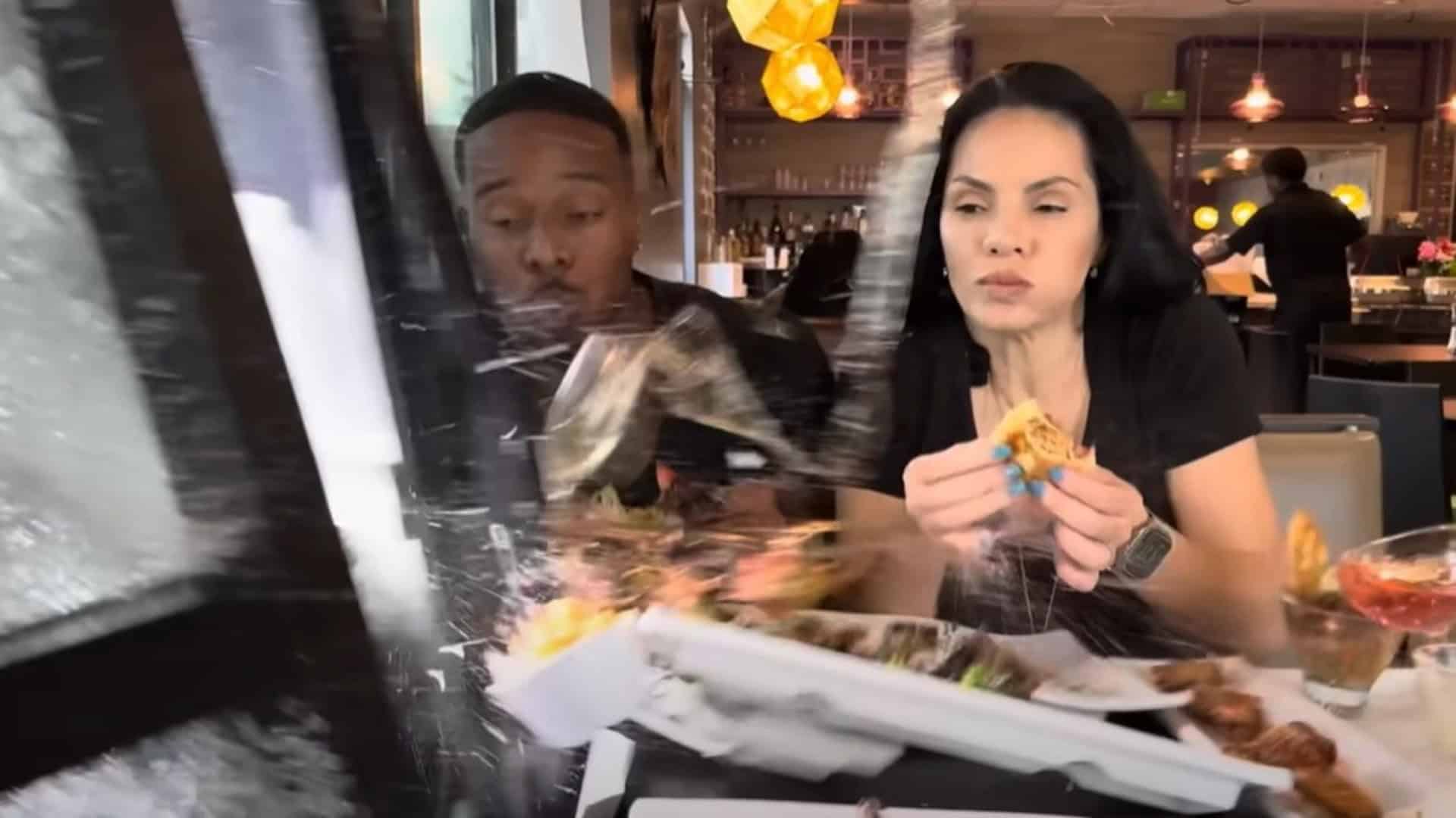 two influencers are almost hit by a car while inside a restaurant