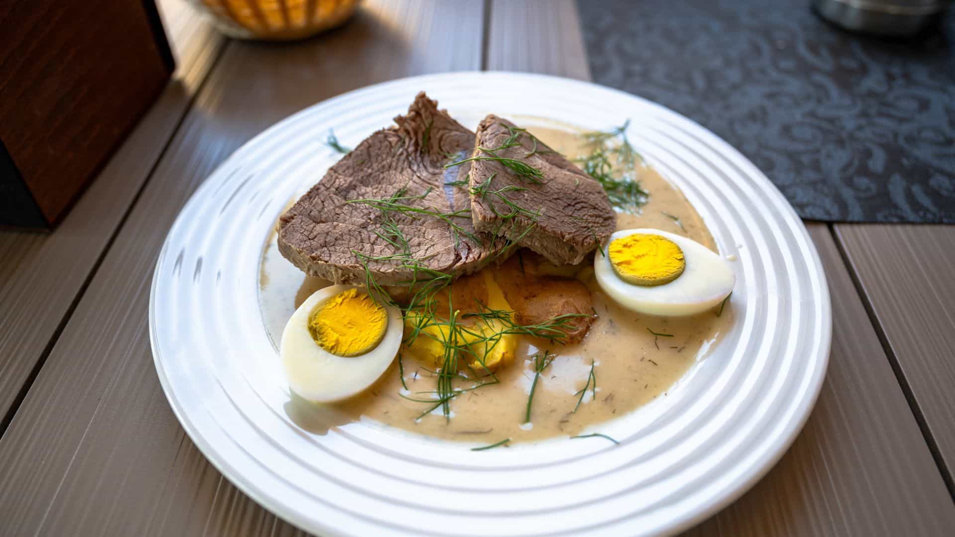 Stewed beef with boiled egg and potato Czech republic