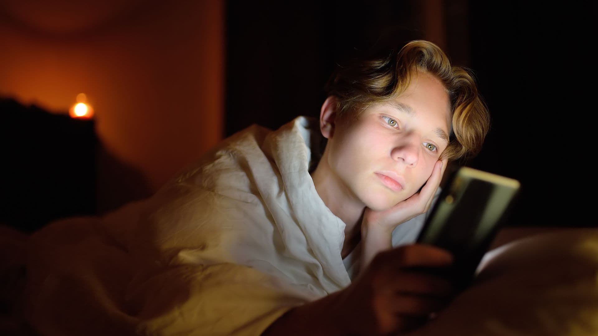 Teenager Chatting with Phone at Night