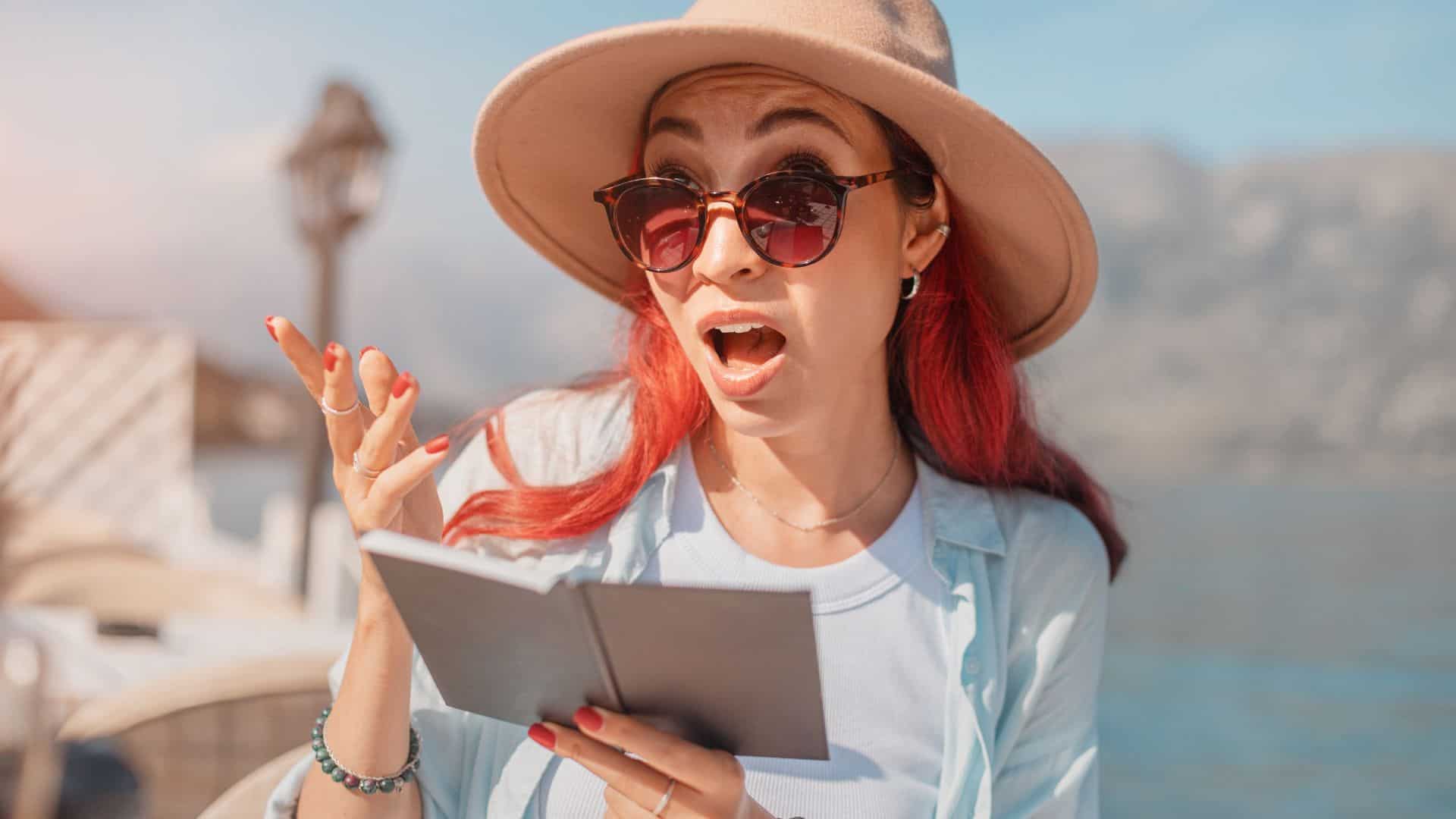 Tourist woman angry while looking at bill