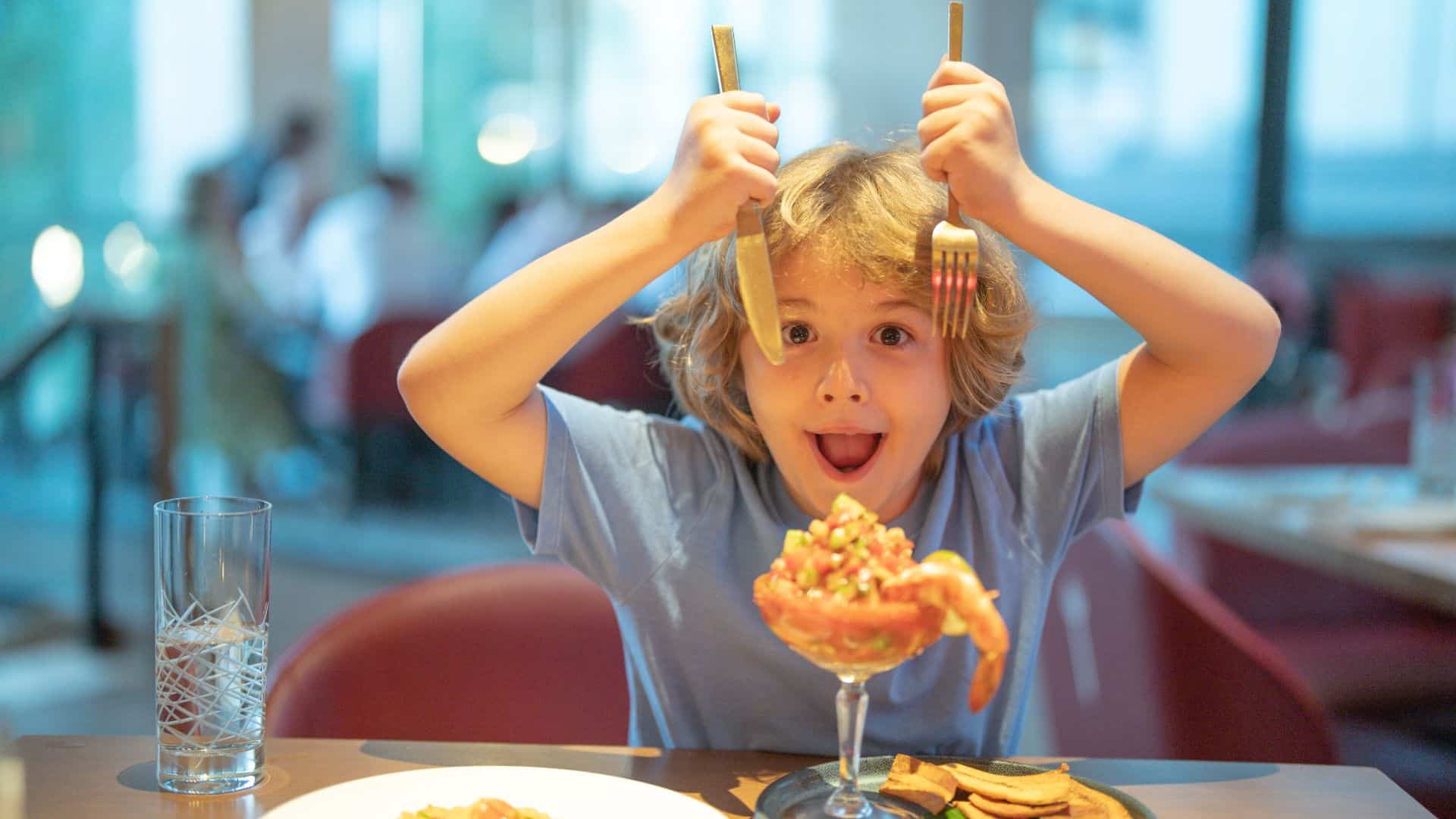 kid holding forks