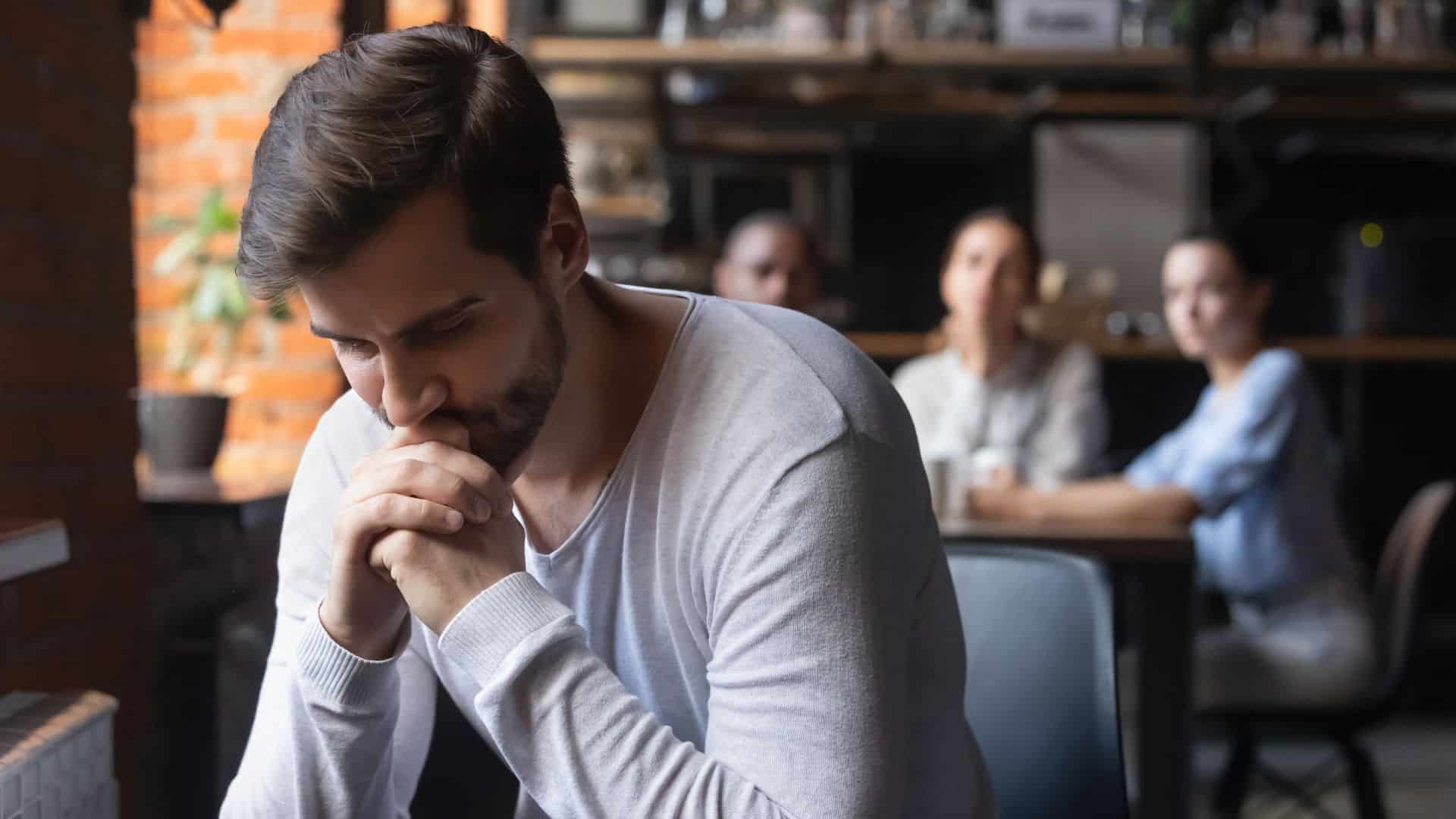 sad man sitting alone and thinking