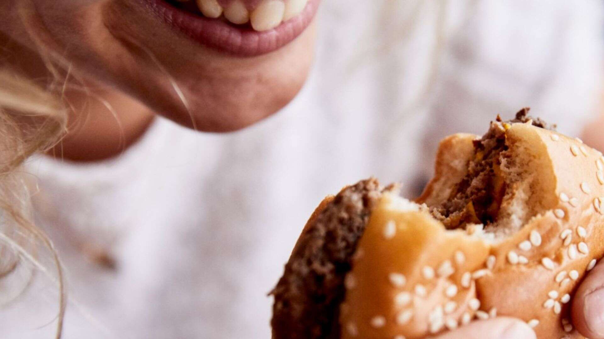woman eating burger