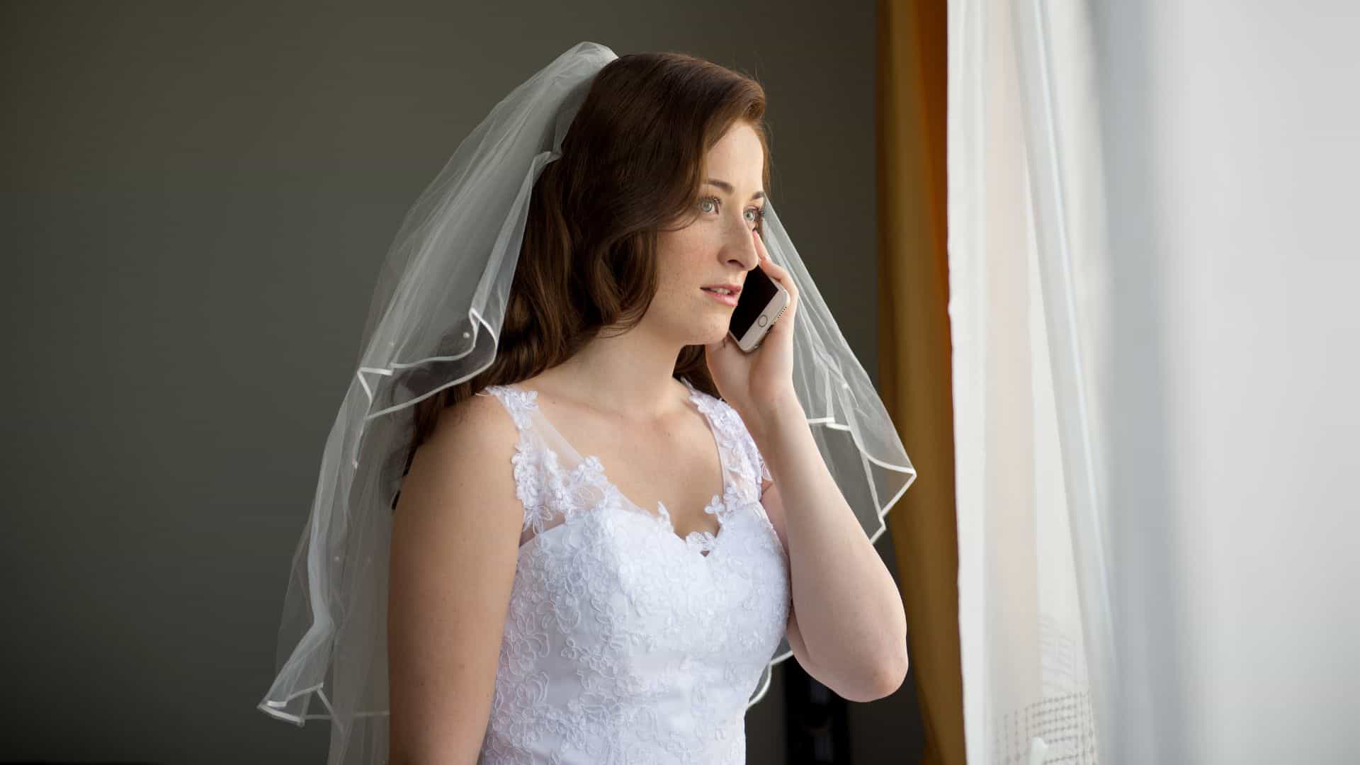 A bride talking on a mobile phone