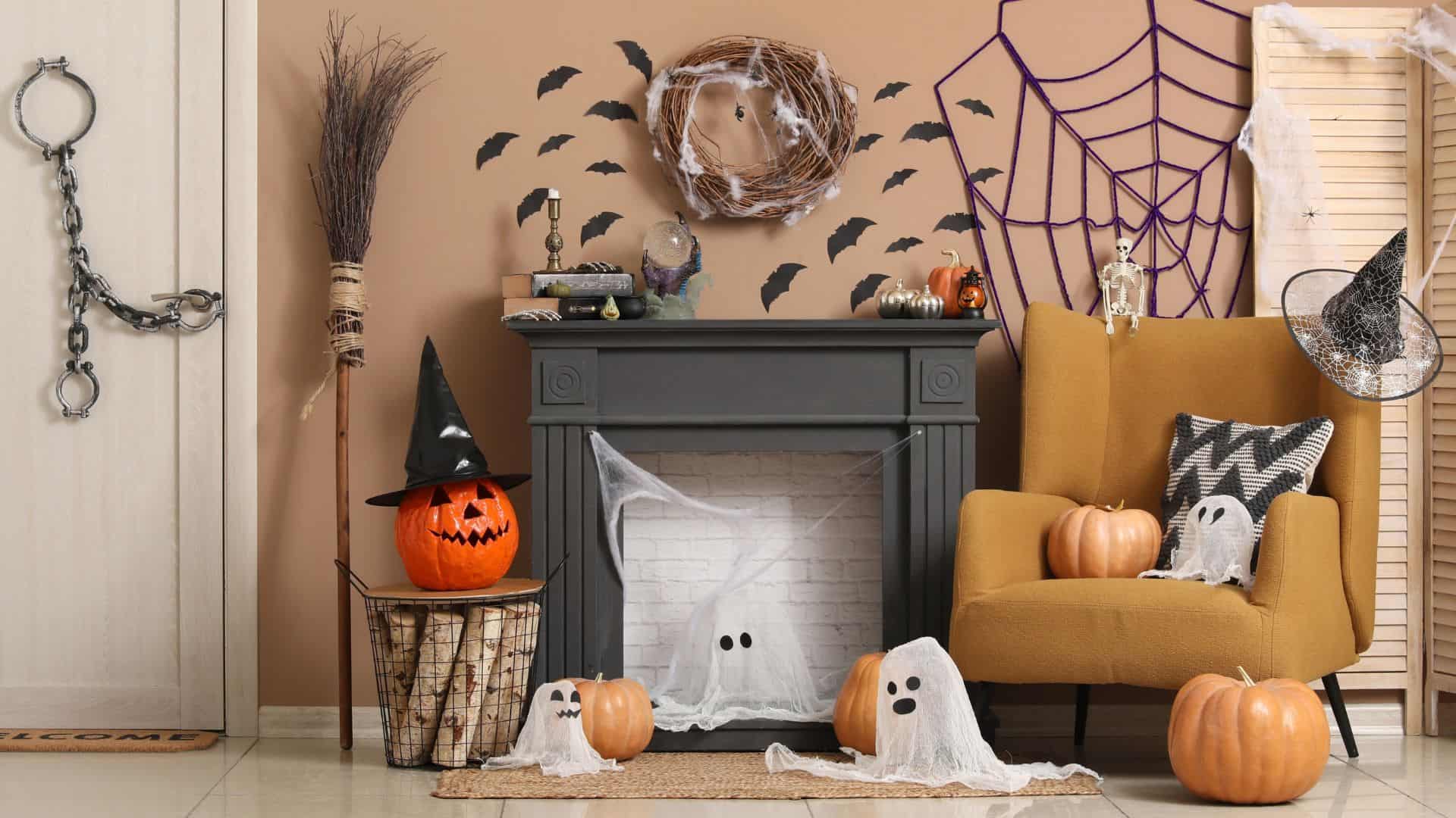 Interior of living room with fireplace, armchair and Halloween decorations