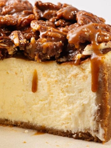 A slice of Pecan Pie cheesecake on a plate.