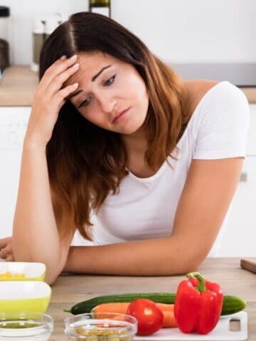 Sad cooking woman