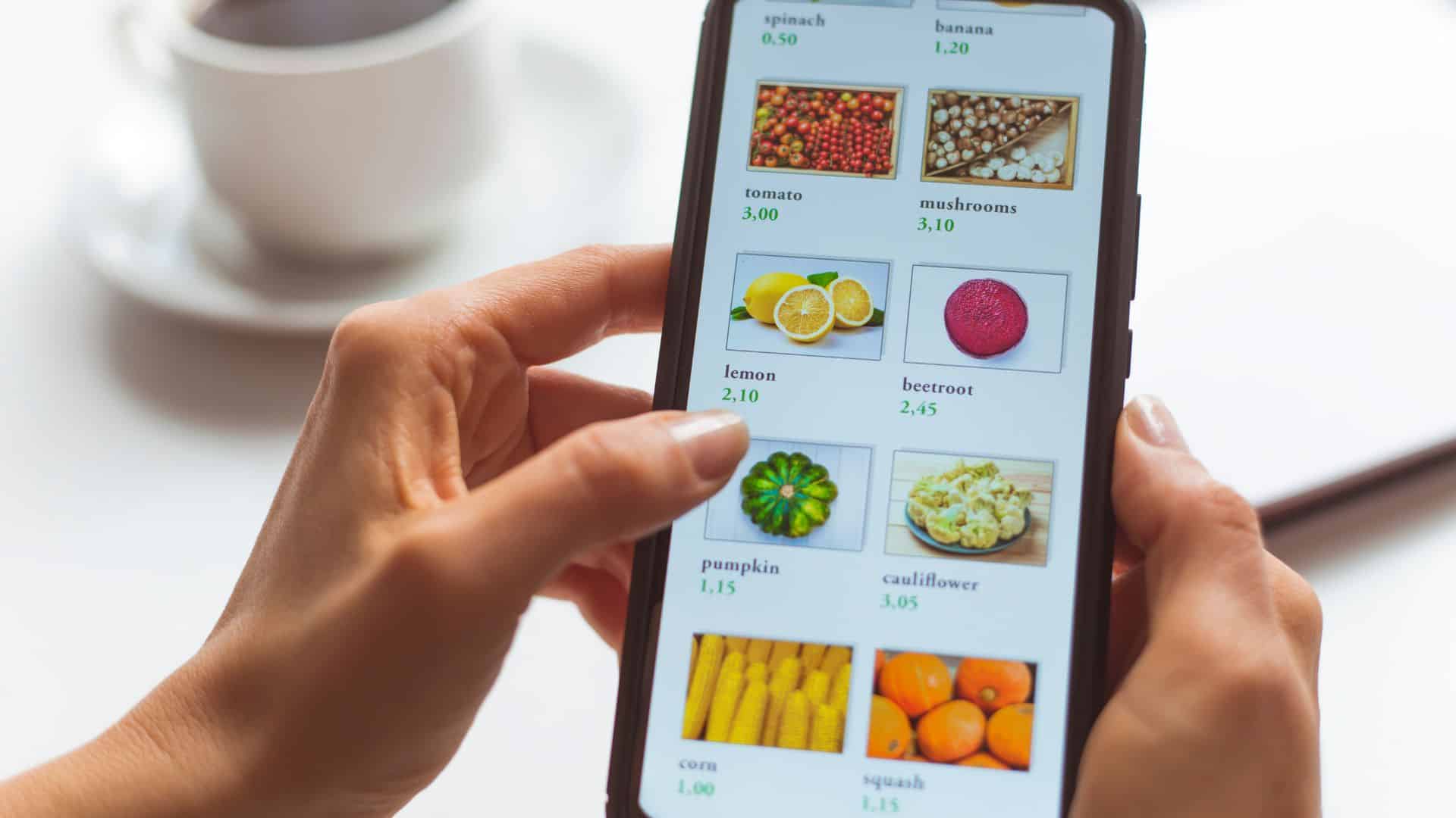 Woman using smartphone buys food online