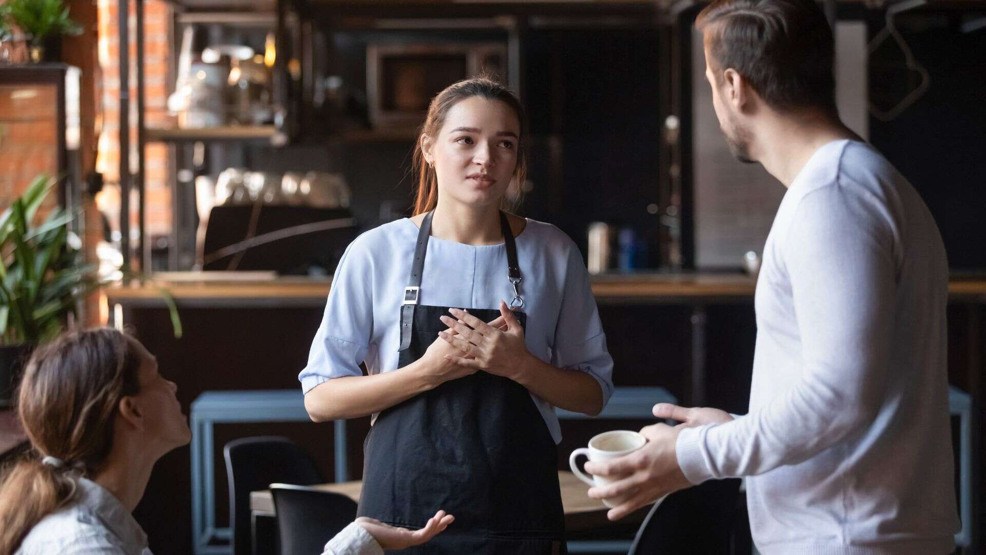 angry couple talking to server