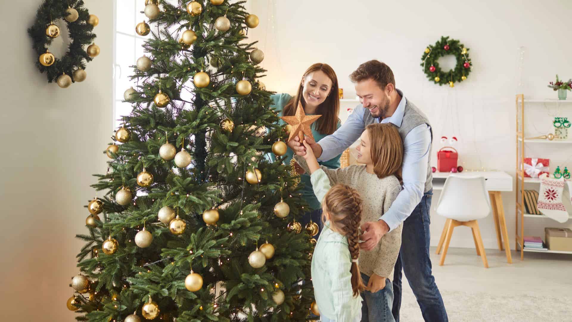 family decorating christmas tree