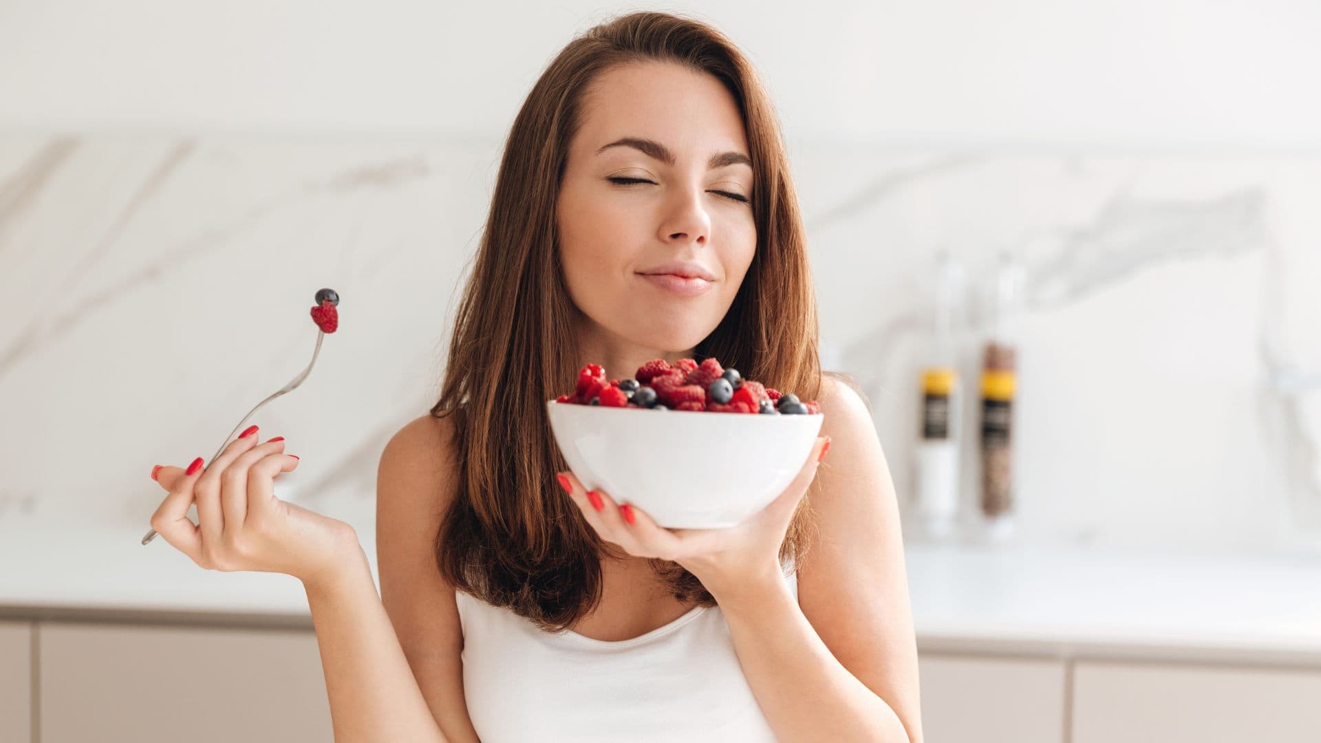 woman eating berries
