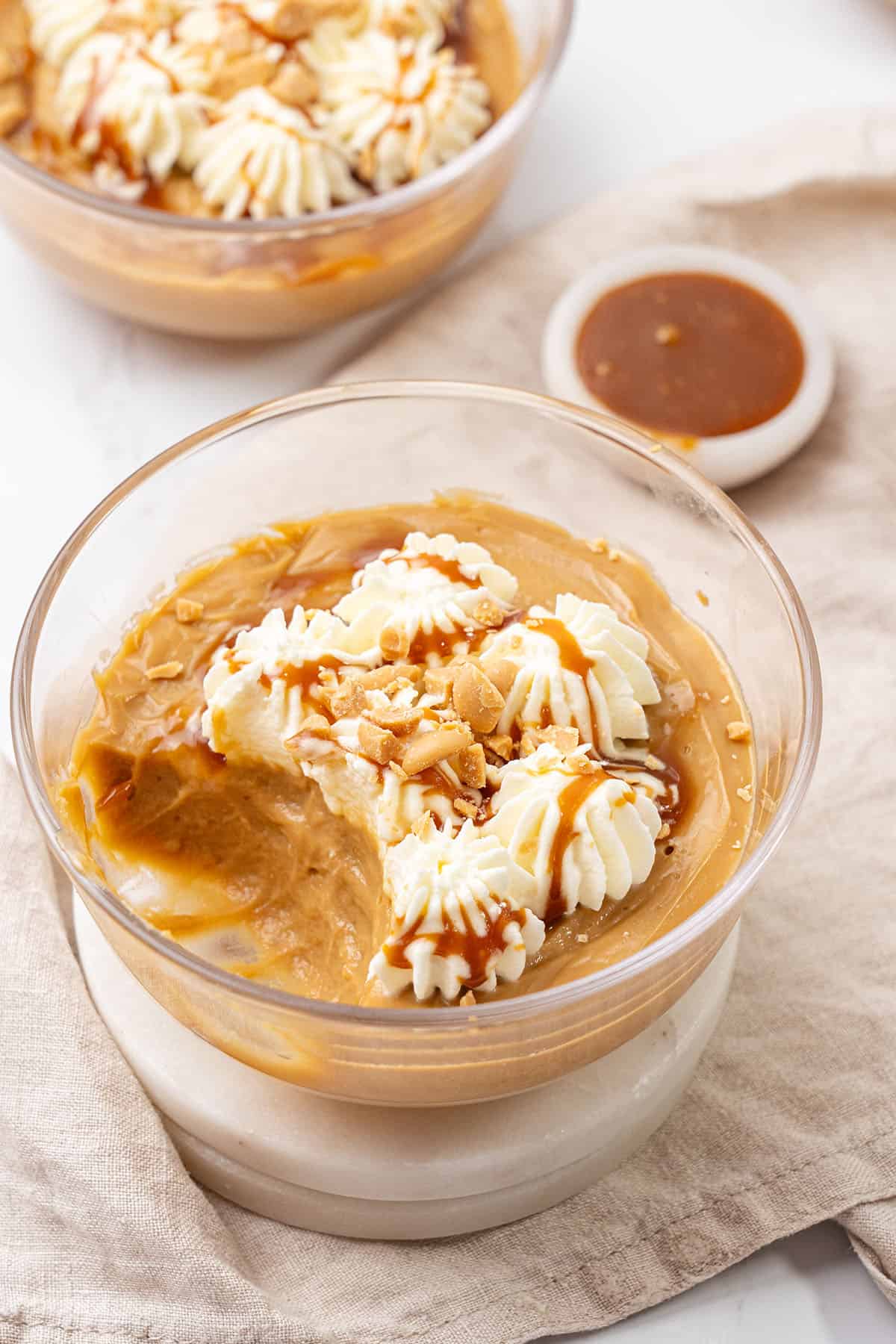 Butterscotch pudding in a glass bowl.