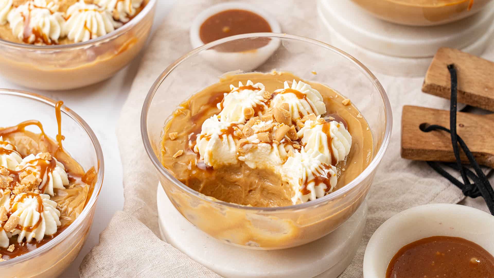 Butterscotch pudding in a glass bowl.