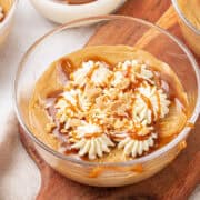 Butterscotch pudding in a glass bowl.