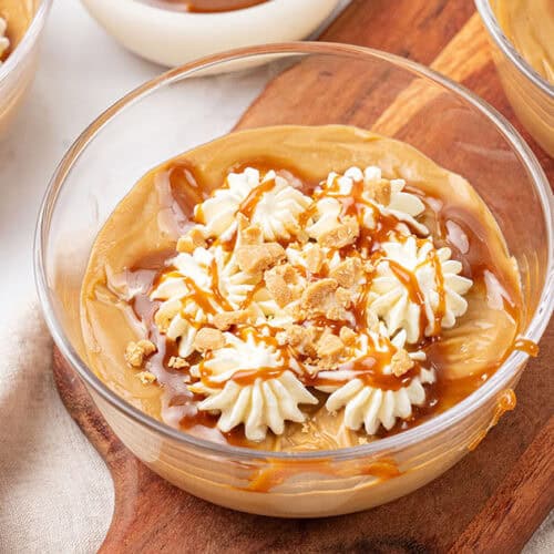 Butterscotch pudding in a glass bowl.