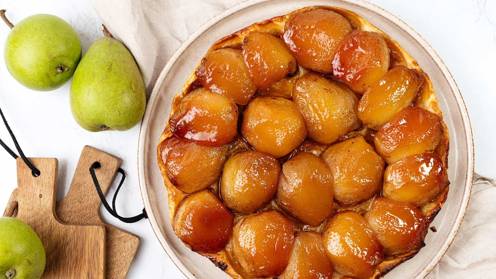 Pear Tarte tatin on a plate.