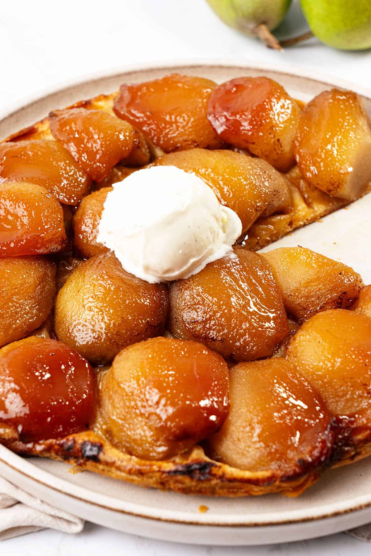 Pear Tarte tatin on a plate.
