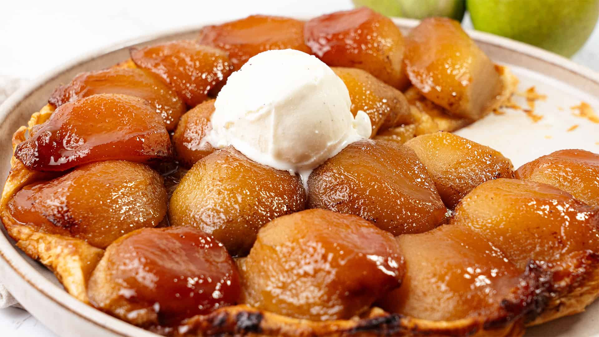 Pear Tarte tatin on a plate.