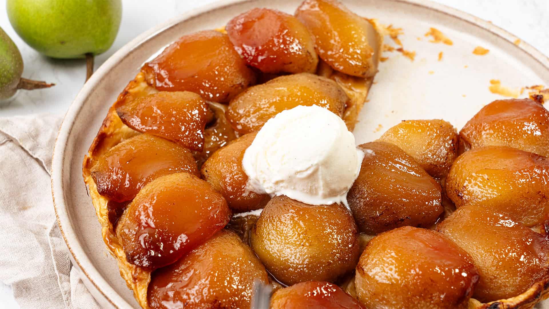 Pear Tarte tatin on a plate.