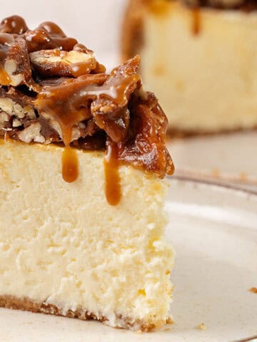 A slice of Pecan Pie cheesecake on a plate.