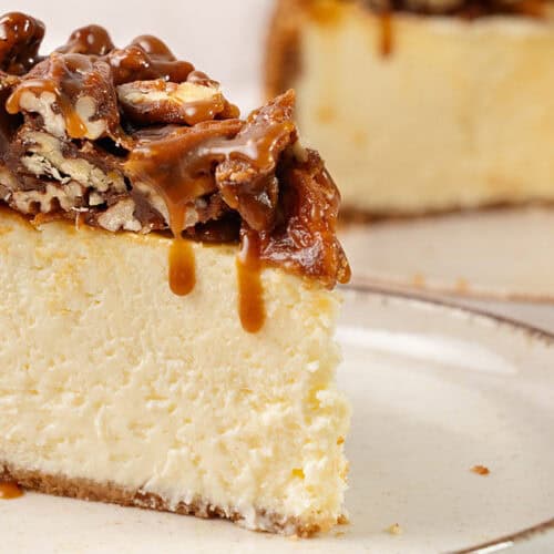 A slice of Pecan Pie cheesecake on a plate.