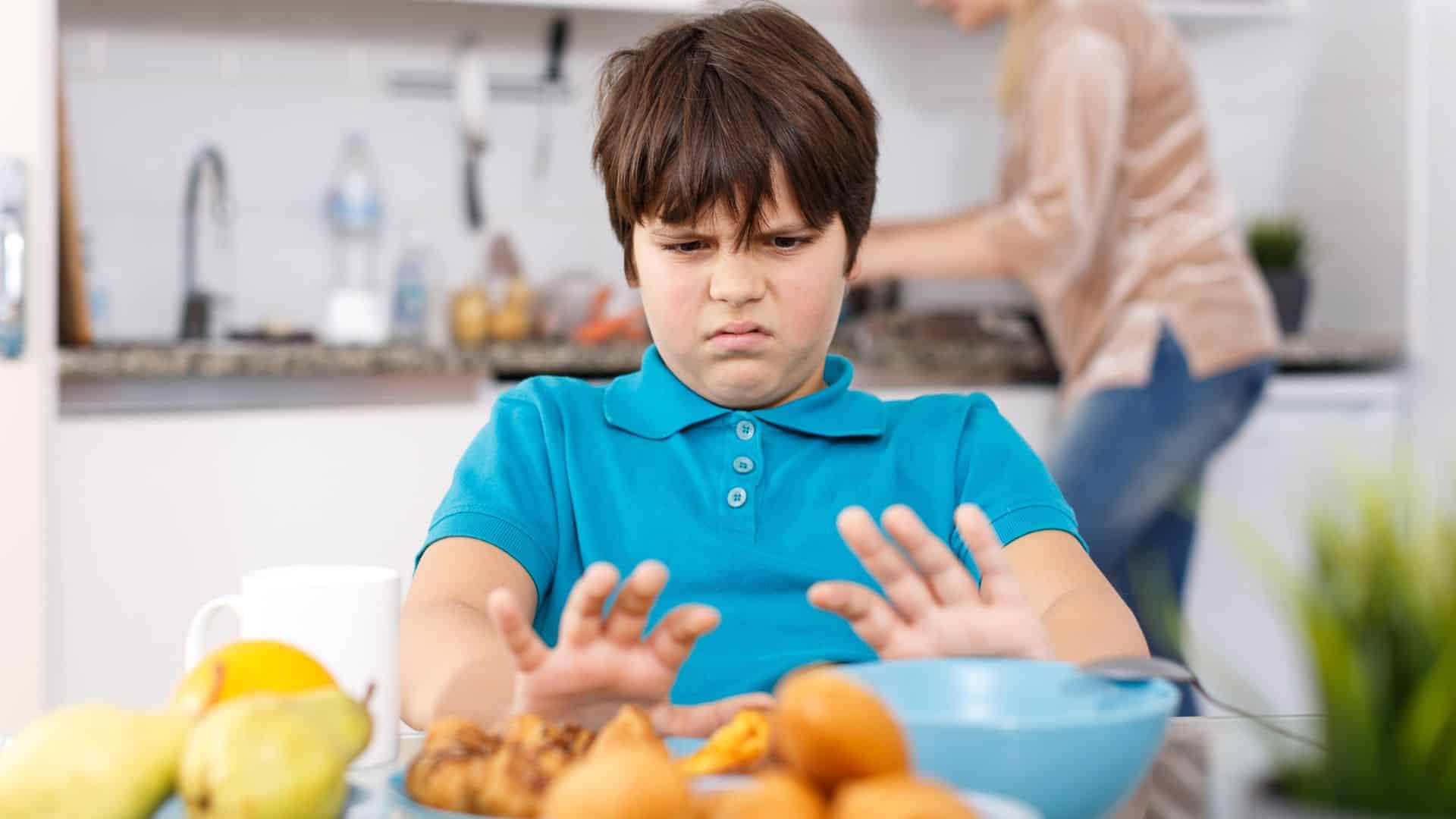boy saying no to food
