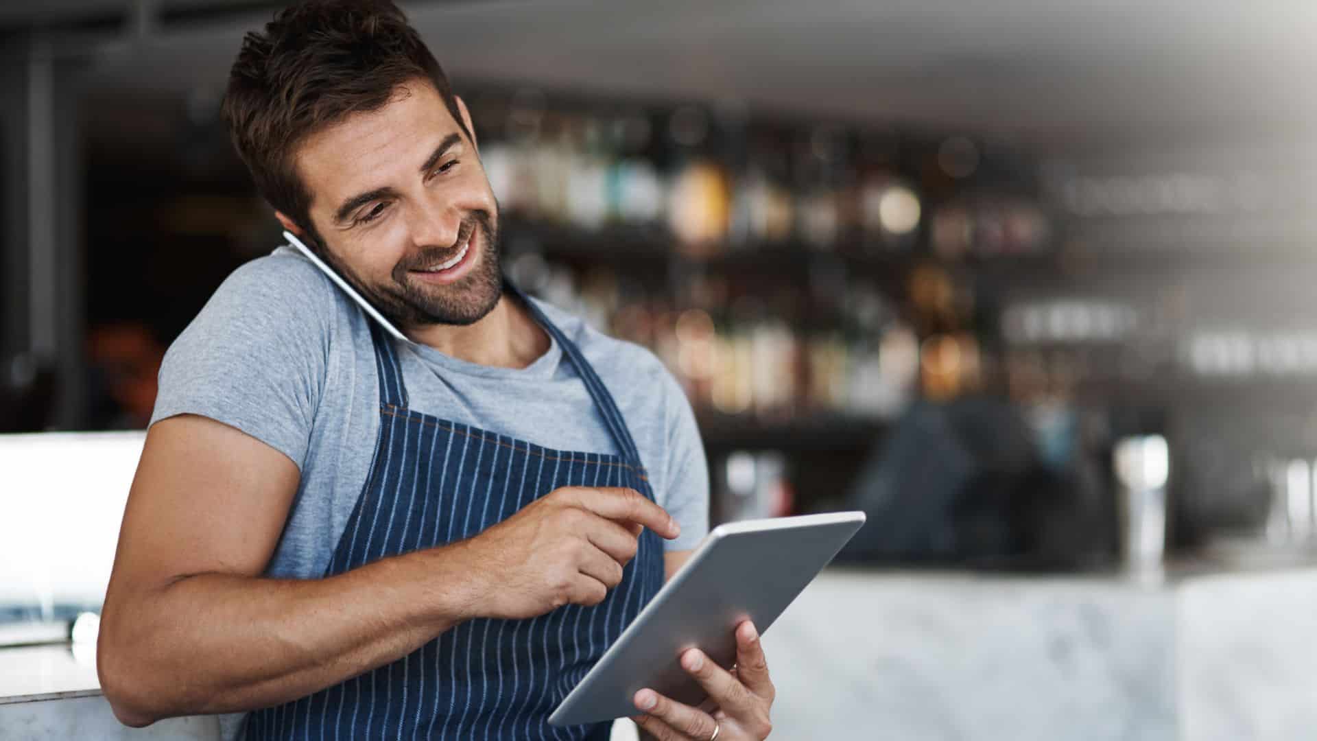 man on phone in a restaurant