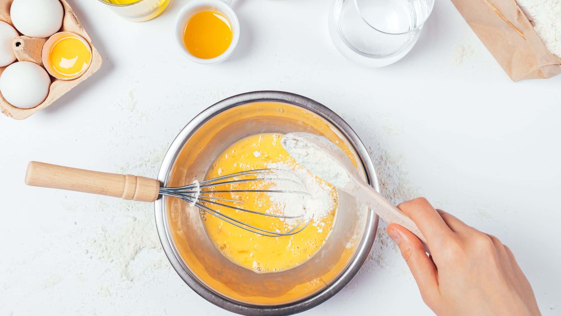 mixing eggs in batter