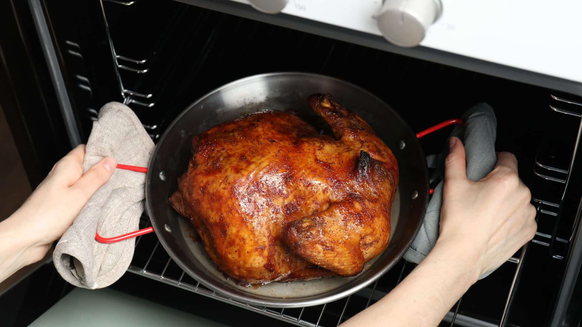 taking turkey out of oven