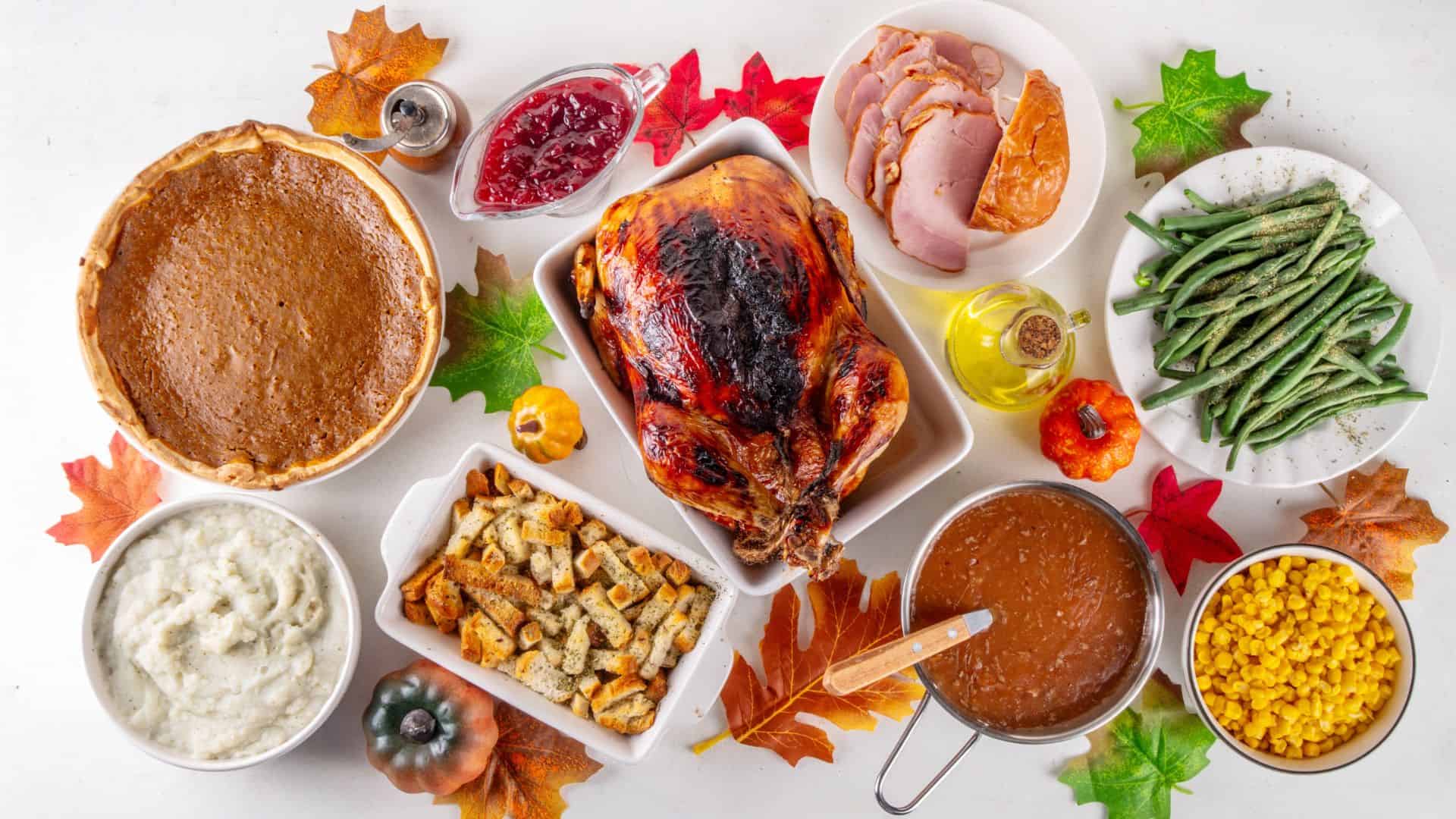 thanksgiving table with turkey and sides